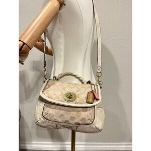 Coach cloth and leather top handle jacquard fabric shoulder bag.